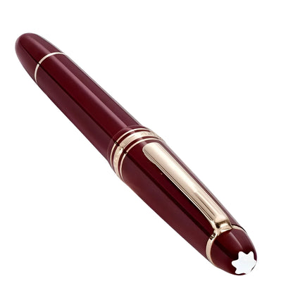 Montblanc roller meisterstück classique bordeaux in finitura oro con dettagli in argento lucido e stella sul cappuccio